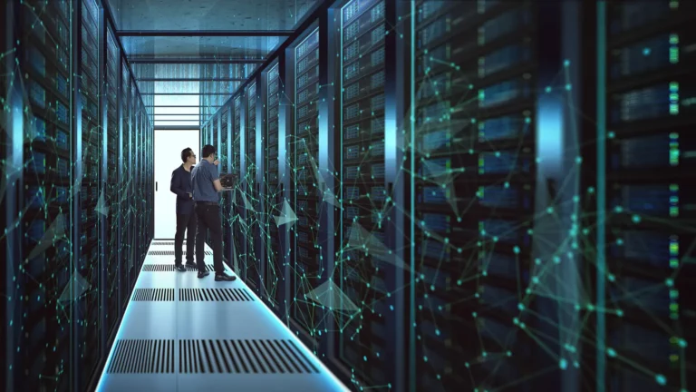 Two professionals examining data in a modern server room highlighting Amazon S3s benefits of flexibility and scalability