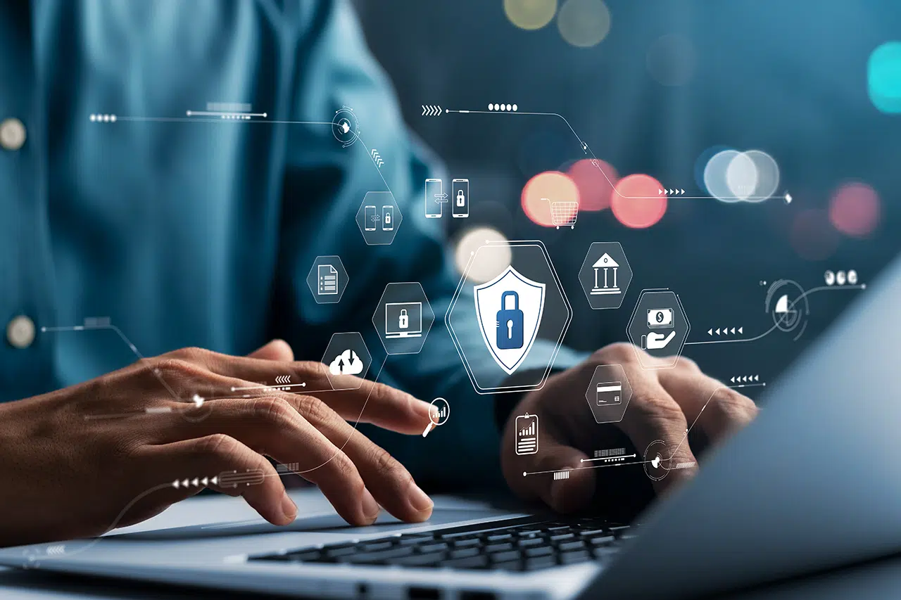 IT professional applying patch management best practices on laptop with security patching icons