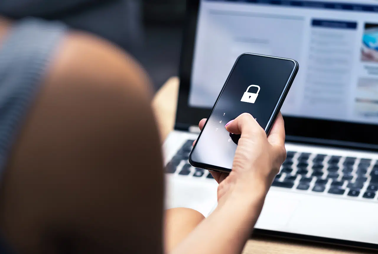 User verifying security patching on smartphone, following patch management best practices