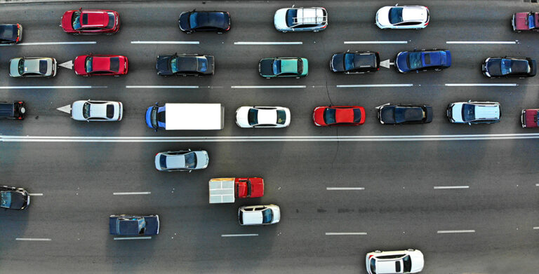 Aerial view of a city traffic jam on a highway illustrating congestion and urban mobility challenges in automation adoption
