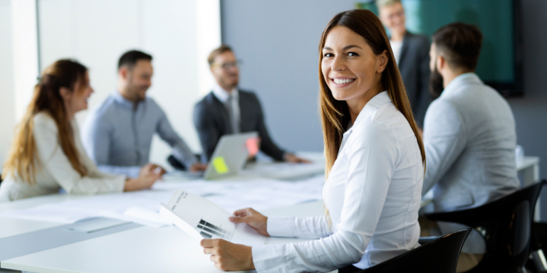 A diverse business team in a meeting reflecting collaboration in talent acquisition