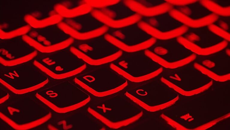 Close up of a backlit keyboard in red symbolizing the importance of cybersecurity for CFOs in managing digital threats