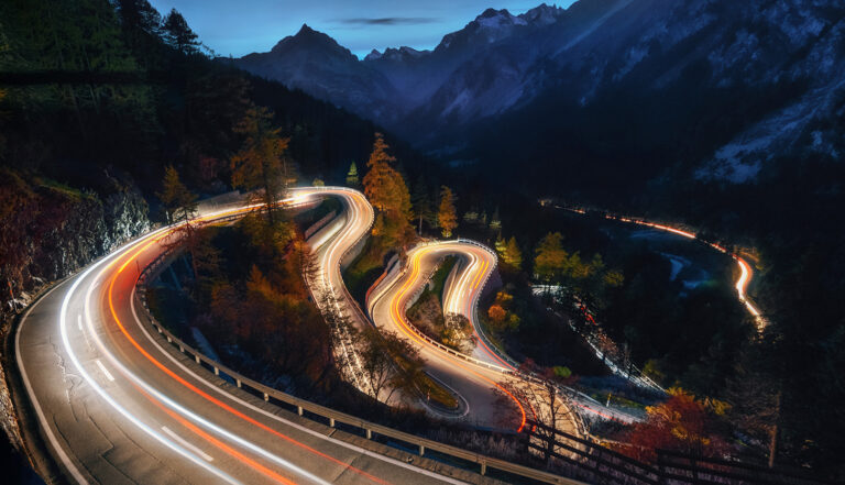 Winding road at night symbolizing digital transformation journey