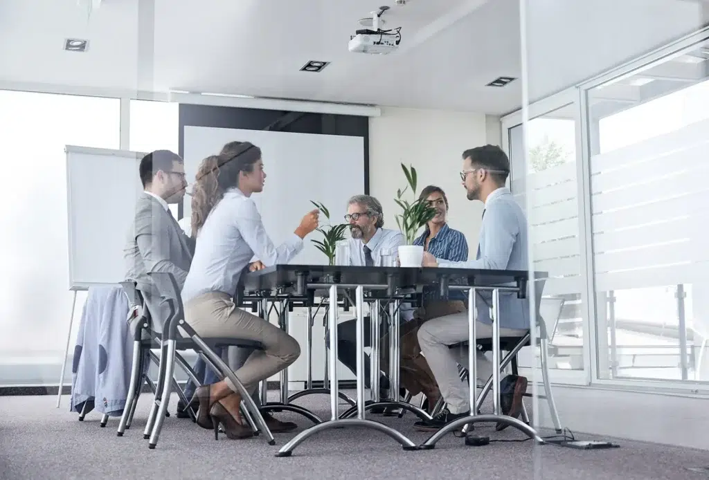 Business meeting of professionals in modern office discussing strategy