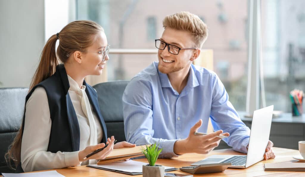 Male and female accountants working in office