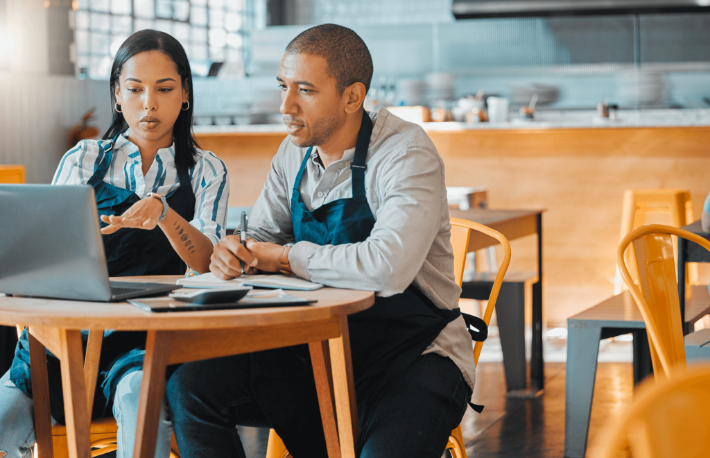 Male and Female restaurant internal staff members performing a brand audit