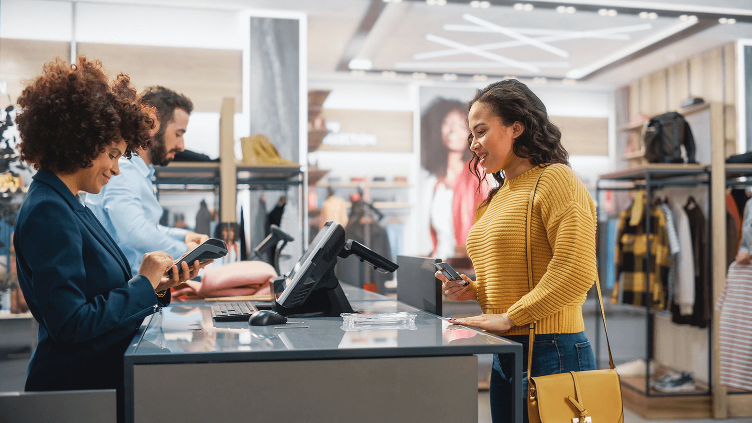 Retail store with staff assisting customers focusing on IT infrastructure