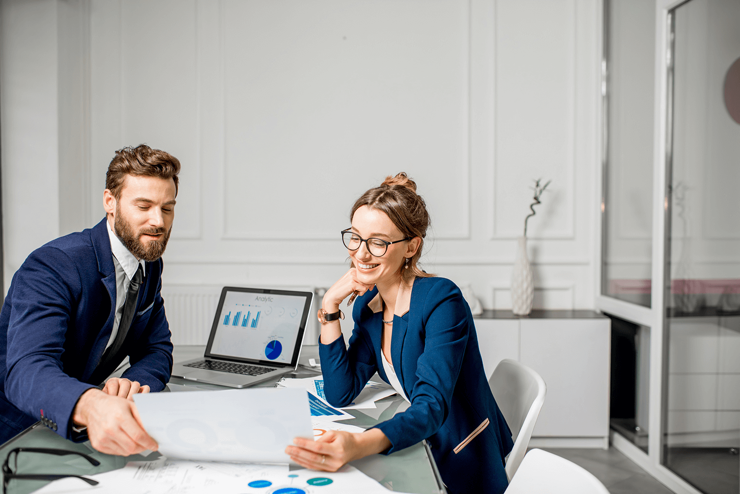 rofessionals reviewing financial data and reports to optimize accounts payable automation processes