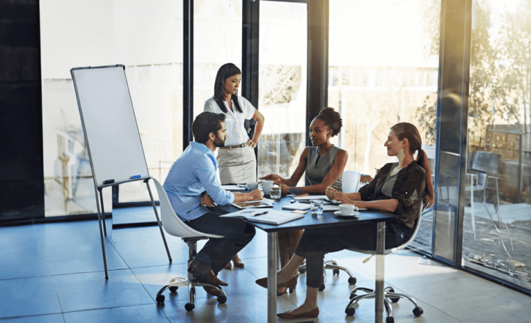 Professionals discussing strategies to improve working capital and cash flow optimization