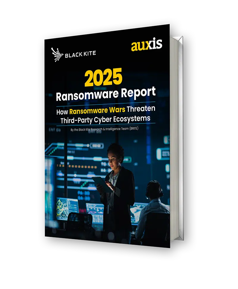 Cover of the 2025 Ransomware Report by Auxis and Black Kite featuring a woman analyzing data in a security operations center