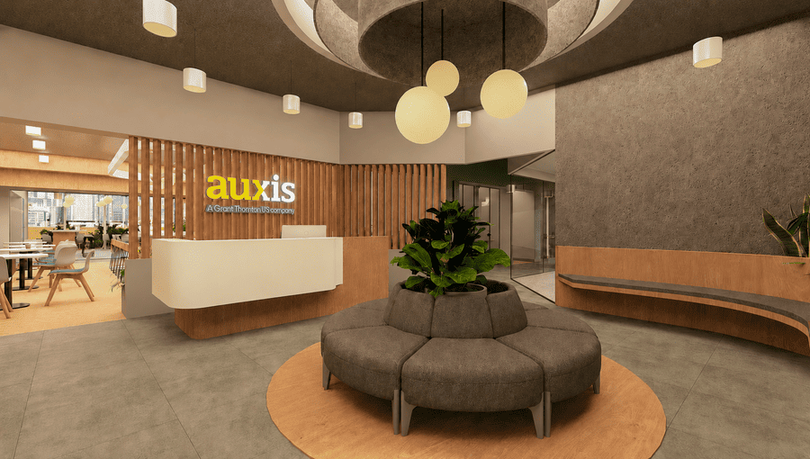 Modern office reception area featuring a circular seating arrangement and vibrant greenery enhancing the workspace atmosphere