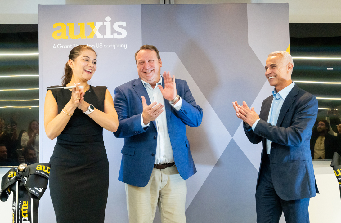 Auxis executives celebrate the opening of a new outsourcing center in Bogotá highlighting growth opportunities in Colombia