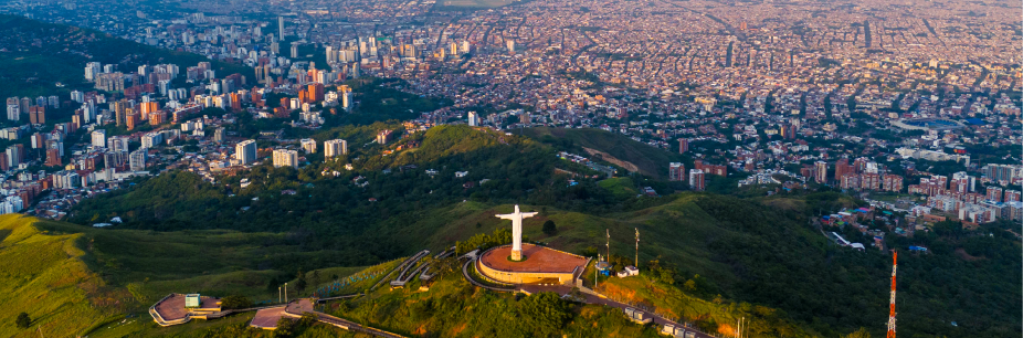 CALI - Auxis Aerial view of Cali Colombia showcasing the iconic Christ the Redeemer statue and urban landscape Perfect for exploring nearshore cities