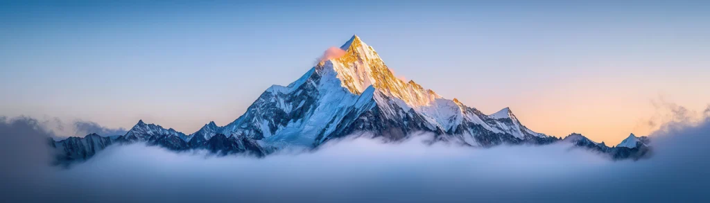 Majestic mountain peak illuminated by sunrise symbolizing the heights of financial and accounting services excellence