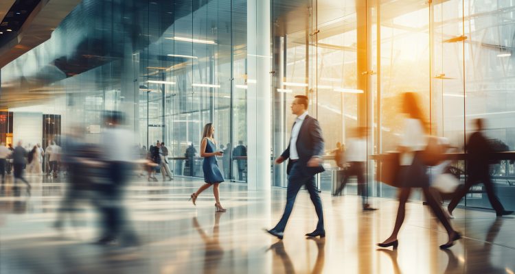 business people walking in corridor office building. Motion blur