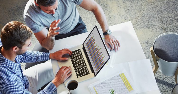 Laptop statistics, communication and business people teamwork on data analysis, accounting or research. Bar graph, cooperation and top view of collaboration team working on chart analytics review.