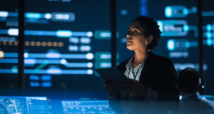 Woman engaging with multiple screens and tablet AI-driven automation