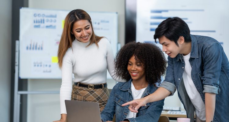 Group of young and energetic Asian business are meeting to start a new project in the company data is analyzed in different part of each department to analyze the strength and weaknesses.