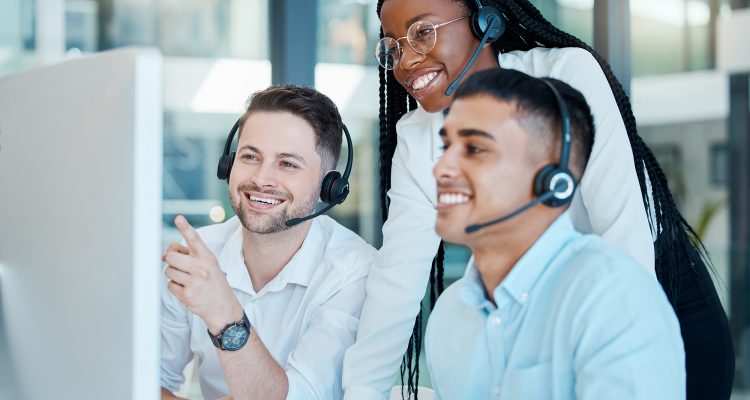 Customer service, call center or telemarketing team and manager or mentor looking happy reading online feedback or sale on website. Diversity in CRM, support and sales consultant training office.