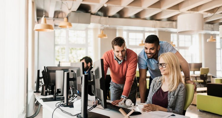 Young people working together on a project in a startup company office