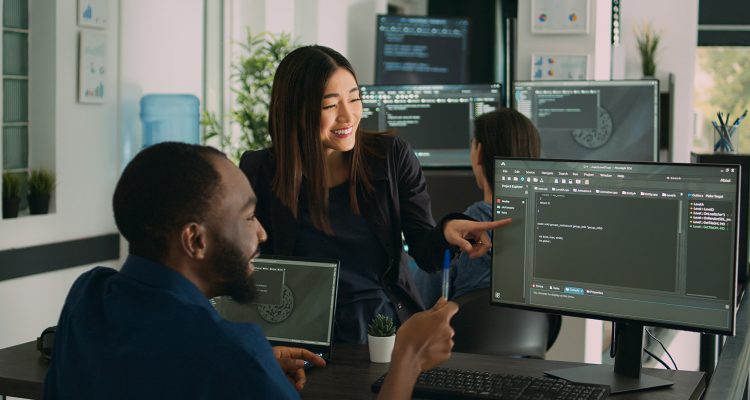Team of diverse programers doing highfive gesture after coding database, celebrating cloud computing achievement. Successful firewall server development with it software language.