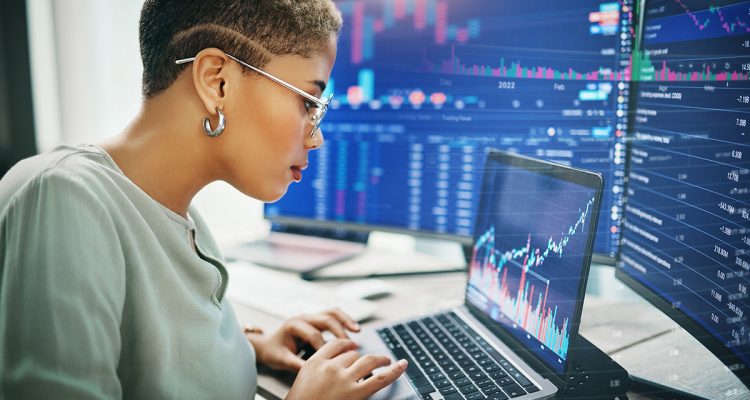 Laptop, investment graphs and business woman reading IPO analytics, financial bank chart or accounting value, info or stocks. Trade price, admin data analysis and profile of broker review statistics.